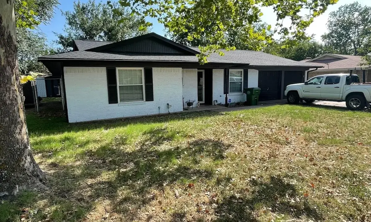 Professional roofing crew working on a residential roof in Coxsackie